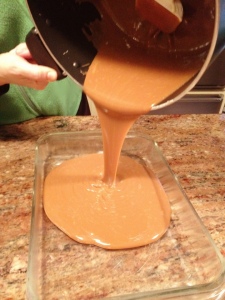 pouring caramel into the dish