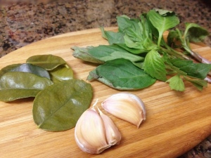 Kaffir lime leaves, garlic cloves, and Thai basil leaves